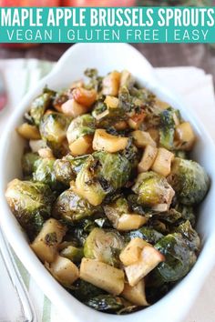 a white bowl filled with brussel sprouts and apples