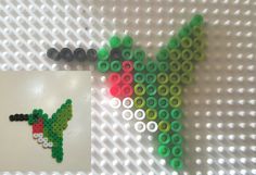 an image of a cactus made out of legos on a table with beads and magnets