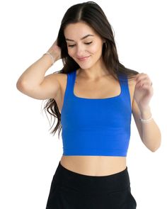 Look sleek yet feel effortless in this clean line, royal blue tank. Crafted from the softest seamless material, it's designed to offer a comfortable and flattering fit for all shapes and sizes. Get the perfect look with its subtle square neckline, sure to keep you looking and feeling your best. One size. Details: One Size 92% Nylon, 8% Spandex Blue Everyday Tank Top, Blue Tank Strap Top, Blue Tank Strap Top For Everyday, Everyday Blue Tops With Built-in Bra, Everyday Blue Top With Built-in Bra, Blue Fitted Tank Top With Square Neck, Fitted Blue Square Neck Tank Top, Fitted Blue Tank Top With Square Neck, Everyday Blue Seamless Tank Top