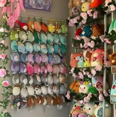 a wall filled with lots of stuffed animals