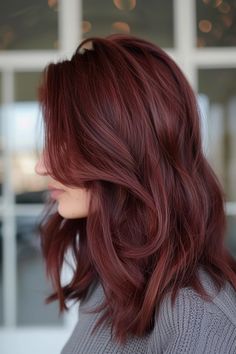 Check out our collection of over 30 stylish burgundy hair ideas we've just rounded up on our blog. From the light mahogany brown hair color you see here to shiny ruby red shades, you're sure to find your next dye! Click the pin to get inspired! Red Light Hair Color, Merlot Red Hair, Ruby Hair Color, Mahogany Red Hair Color, Neutral Red Hair, Red Hair Tones, Cool Tone Red Hair