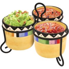 three bowls filled with different types of food on top of each other and one has guacamole in it