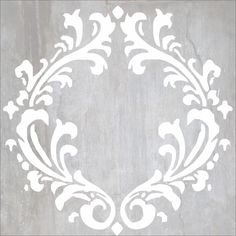 an ornate white design on a concrete wall