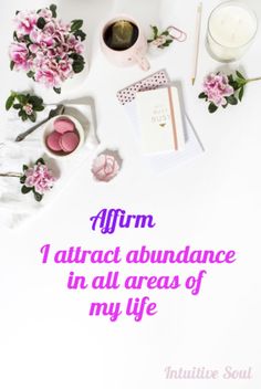 the words affirm i attract abundance in all areas of my life are surrounded by pink flowers