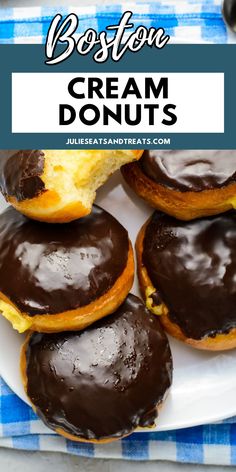 chocolate covered cream donuts on a white plate with blue and white checkered tablecloth