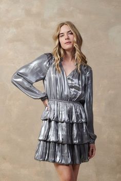 Details: Metallic Foil Dress Long Sleeve Split Neck Ruffle Tiered Sizes: XS Small Medium Large Color: Gold Silver Fabric: 64% RECYCLED POLYESTER 36% POLYESTER Foil Dress, Dress Png, Aurora Dress, Tiered Mini Dress, Silver Fabric, Ruffled Dress, Glamorous Look, Metallic Foil, Silver Dress