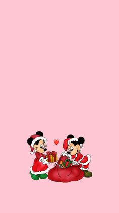 two mickey and minnie mouses sitting on top of a pink background with hearts in the air