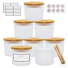 six plastic containers with wooden lids and chopsticks next to each other on a white background