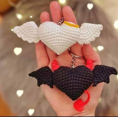 a crocheted keychain with an angel on it in the palm of someone's hand