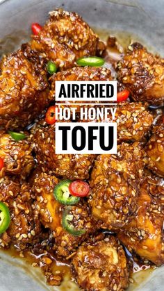 fried hot honey tofu in a bowl with sesame seeds