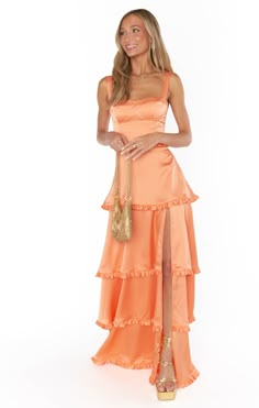 Get swept away by romance in the Lady Corset Dress. Beautiful tiers of luxe satin fall to a maxi hem with a side slit, and topped with a figure flattering corset bodice! Let her be the statement of your look paired with dainty jewelry and barely there heels. Pastel Dress Formal, Pastel Floral Dress, Prom 23, Orange Prom Dresses, Hoco Inspo, School Dance Dresses, Spring Formal, Prom Dress Inspo, Pastel Dress