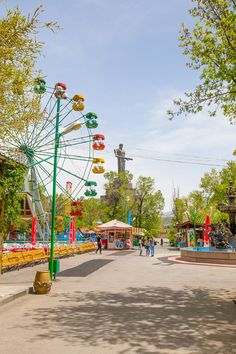 a ferris wheel in the middle of a park