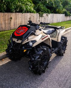 a white and black four wheeler parked on the street