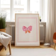 a room with a chair, rug and painting on the wall next to a radiator