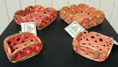 three decorative baskets are sitting on a table with price tags attached to the handles and sides