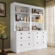 a white bookcase with many books on it