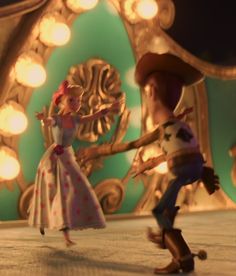 two animated characters are dancing in front of a mirror