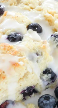 blueberry scones with icing on a white plate