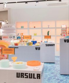 there are many different items on display in the store's exhibit room, including bowls and plates