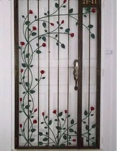 the door is decorated with red flowers and green leaves, as well as a decorative glass panel