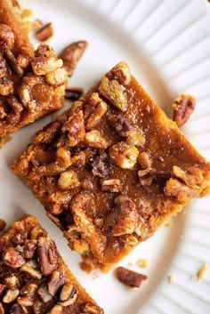 three pieces of pecan pie on a white plate