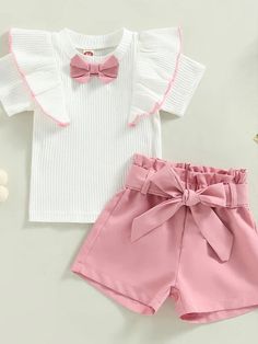 Introducing the perfect summer outfit for your little girl! With a ruffled bowknot shirt, shorts with a matching belt, and a variety of sizes from 12-24 months to 4T. Made with lightweight and breathable cotton and polyester materials, this casual set is perfect for the hot summer months. With its solid color and contrast details, your child will be dressed to impress everywhere she goes! #kidsclothingstore #kidssummer #summerfashiontrends #kidsfashiontrends Ruffle Outfit, Toddler Girl Shorts, Dressed To Impress, Kids Fashion Trends, Perfect Summer Outfit, Kids Fashion Clothes, Summer Fashion Trends, Toddler Boy Outfits, Summer Months