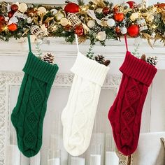 three christmas stockings hanging from a mantel