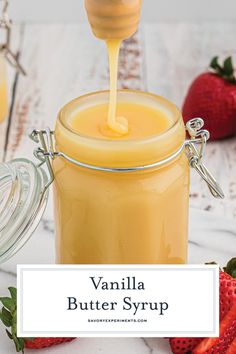 vanilla butter syrup in a glass jar with strawberries