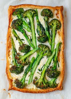 broccoli and cheese spread on top of a square casserole