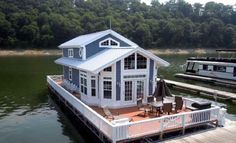 a boat dock with a house on it