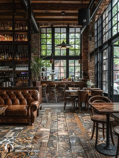 the interior of a restaurant with wooden tables and leather couches in front of large windows