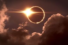 the solar eclipse is seen through clouds in this image