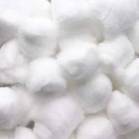 white cotton balls are piled together on top of each other