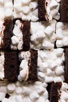 marshmallows and chocolate brownies are arranged on top of each other