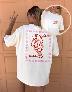 ✺ LOBSTER CIAO SEASHELL SHIRT ✺ * Q U I C K F A C T S * This design is a unique, one-of-a-kind awesome illustration that has been created in house. The design has a distressed effect, which gives a tee a worn-out look. This effect is intentional. ✺ 100% Cotton (fiber content may vary for different colors) ✺ Classic fit ✺ Sizing is unisex, so it fits both women and men (true to size) Please note that colours may appear different on different digital screens and may not be a true representation of Relaxed Fit Short Sleeve Shirt With Front Print, Relaxed Fit Shirt With Front Print And Short Sleeves, Tomato Shirt, Lobster Shirt, Tomato Girl, Aesthetic Sea, Coastal Aesthetic, Ciao Bella, Girl Shirt