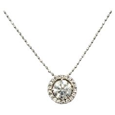 This sparkling diamond halo pendant necklace is stunningly simple, yet undeniably beautiful. The delicate ball chain and icy circle of natural round diamonds goes with just about everything. It features a single round brilliant diamond prong set at the center of the piece, surrounded by a shimmering halo of additional diamonds. The white gold setting further enhances the white brilliance of the stones. It would look great layered with other necklaces or equally gorgeous worn on its own. Metal: 1 Round Diamond Halo, Diamond Circle Pendant, White Gold Necklace, White Gold Set, Halo Pendant, Sparkling Diamond, White Gold Necklaces, Diamond Halo, Circle Pendant