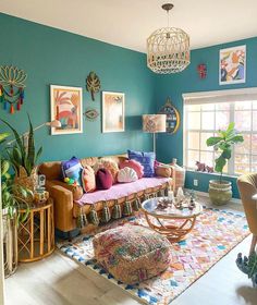 a living room filled with lots of furniture next to a wall mounted art piece on the wall