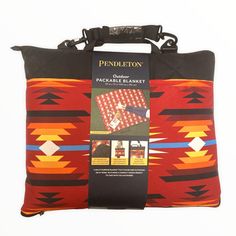 the pendleton pillow is on display in front of a white background with an orange and black pattern