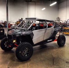 an off road vehicle parked in a garage