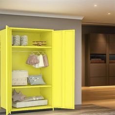 an open yellow cabinet with clothes on it