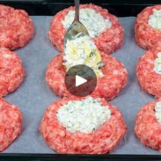 raw hamburger patties with cheese being spooned into them