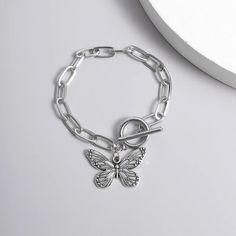 Introducing Our Stunning Butterfly Pendant Chain Bracelet Welcome to our store, where elegance meets affordability! Our Butterfly Pendant Chain Bracelet is a timeless piece that adds a touch of grace to any outfit. Crafted with precision and passion, this bracelet embodies the essence of charm. This bracelet is designed for the modern woman who appreciates beauty and quality. With its straight-line buckle chain and delicate butterfly pendant, it effortlessly blends Korean fashion sensibilities with international appeal. Embrace your femininity with this exquisite piece, perfect for both casual outings and special occasions. Product Features: Chain & Link Bracelet Made of high-quality zinc alloy Charming bowknot design Easy-hook clasp for convenience Available in a stunning silver color Lig Nickel Free Metal Chain Bracelet, Minimalist Silver Metal Charm Bracelet, Minimalist Silver Alloy Bracelets, Nickel-free Metal Bracelets, Dainty Silver Metal Chain Bracelet, Trendy Stainless Steel Charm Bracelet, Dainty Silver Stainless Steel Chain Bracelet, Nickel Free Link Bracelets, Nickel-free Link Bracelets