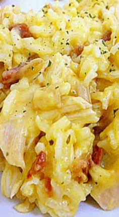 an image of scrambled eggs with bacon on a plate