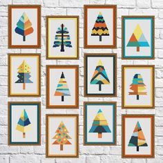 a wall hanging with nine different types of trees on it's sides, all framed in wooden frames