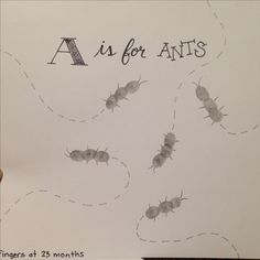 a hand holding up a piece of paper with bugs on it and the words a is for ants