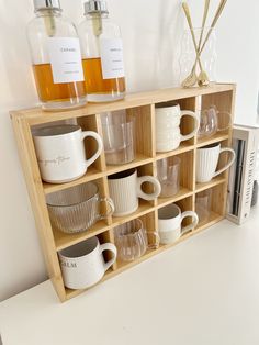 This wooden mug shelf unit is carefully crafted from high-quality materialsproviding a sturdy and long-lasting storage solution for your favorite mugsMade with precision and expert craftsmanshipthis unit will add a touch of elegance and organization to your kitchen or dining areaWith its charming design and durabilityyou won't have to worry about cluttered countertops or fragile mugsKeep your mugs within reach and beautifully displayed with our Wooden Mug Shelf UnitDimensionsWidt Kitchen Shelf Decorations, Student Kitchen Decor, Mug Cabinet Organization, Cup Shelf Display, Cute Kitchen Decor Apartment, Mugs Organization, Mug Shelf Display, Countertops Decor Ideas