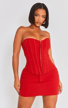 Blessed with a body like an hourglass Good for you girl. PLT Shape is designed with you in mind, with a few figure and curve enhancing tweaks to give you the perfect fit.   Dare to stand out from the crowd in this shape red lace up back woven corset. Brought to you in a red hue woven material with a lace up back design and a curve-contouring corset fit, how can you not be obsessed We are loving this shape corset styled with the matching skirt, clear strap heels and gold accessories for a weekend Red Corset And Skirt, Corset And Skirt, Clear Strap Heels, Red Corset, Fashion Aesthetics, Corset Style, Women Corset, Red Lace, Strap Heels