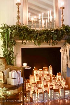 a fireplace decorated with candles and christmas decorations