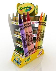 crayons are stacked up in a display case with the name crayols on it