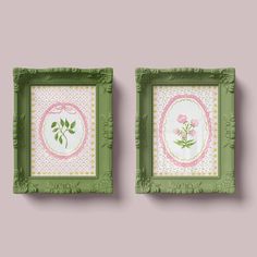 two green framed pictures with pink flowers on them